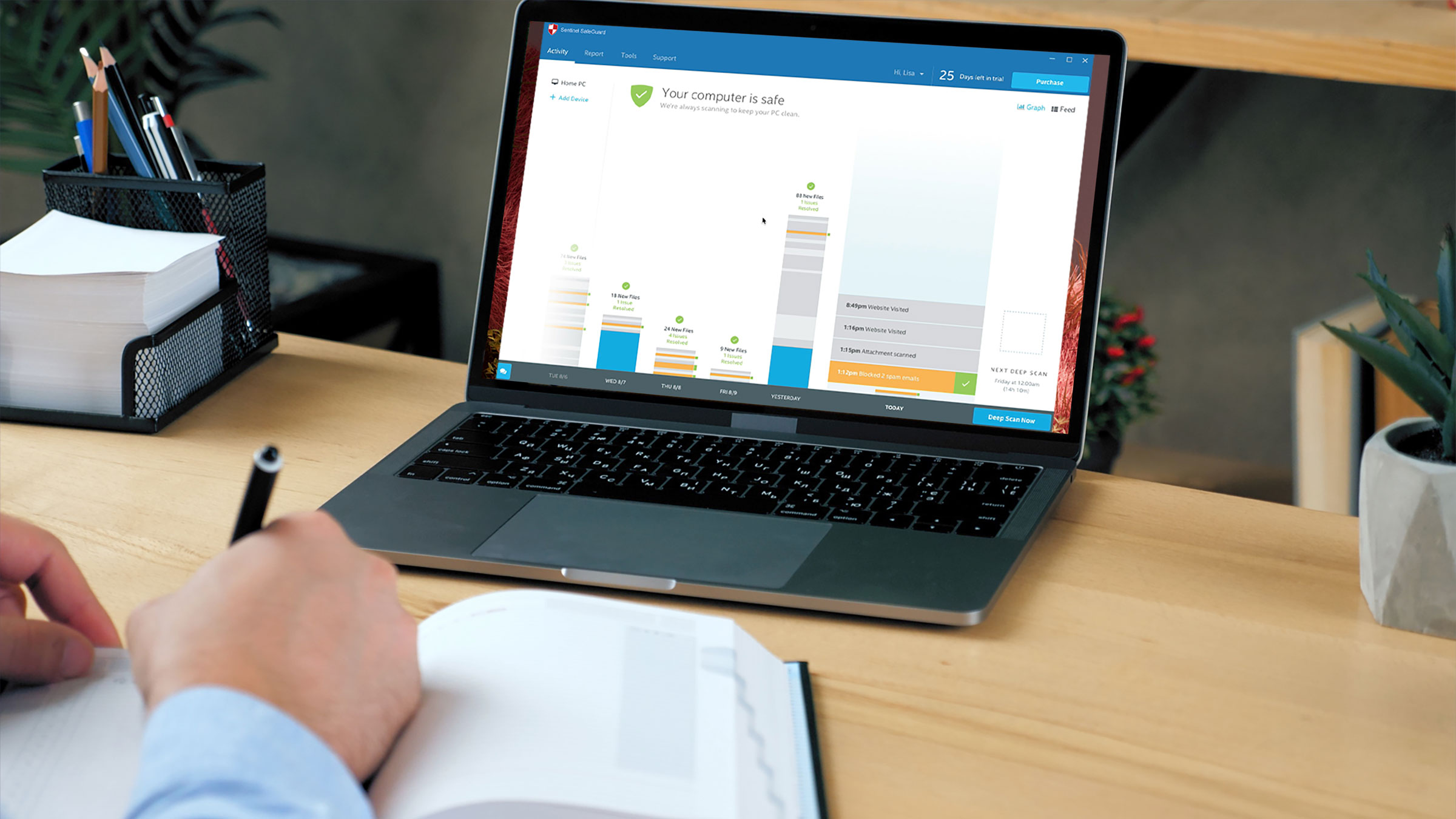 Sentinel SafeGuard pop-up on laptop with user at keyboard